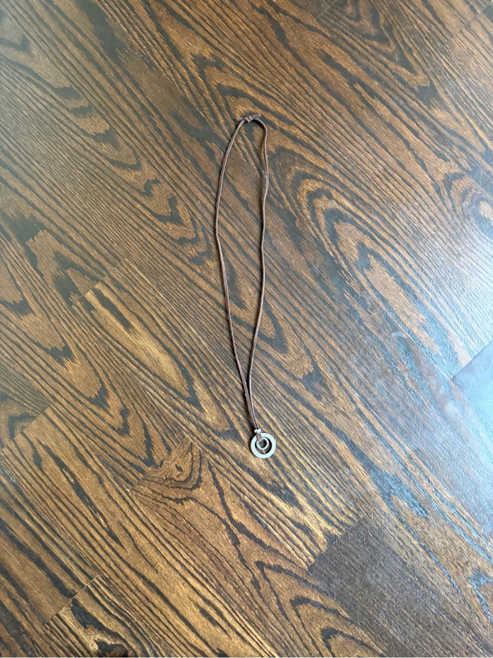 Double-Ring silver-toned Pendant Necklace on a Brown Leather Cord